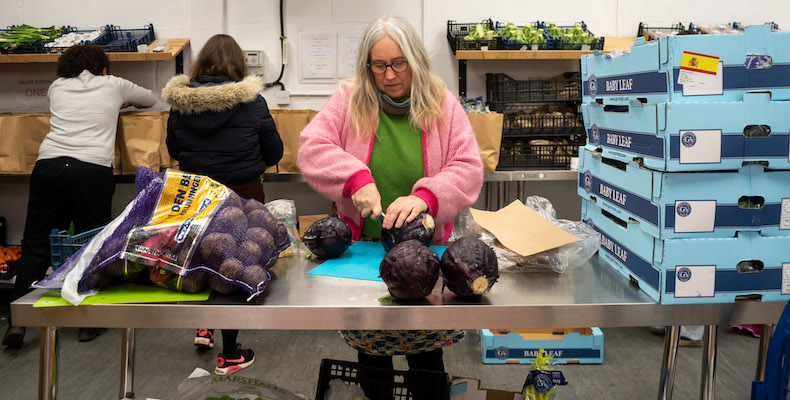 A MAZI volunteer preparing the recipe kits